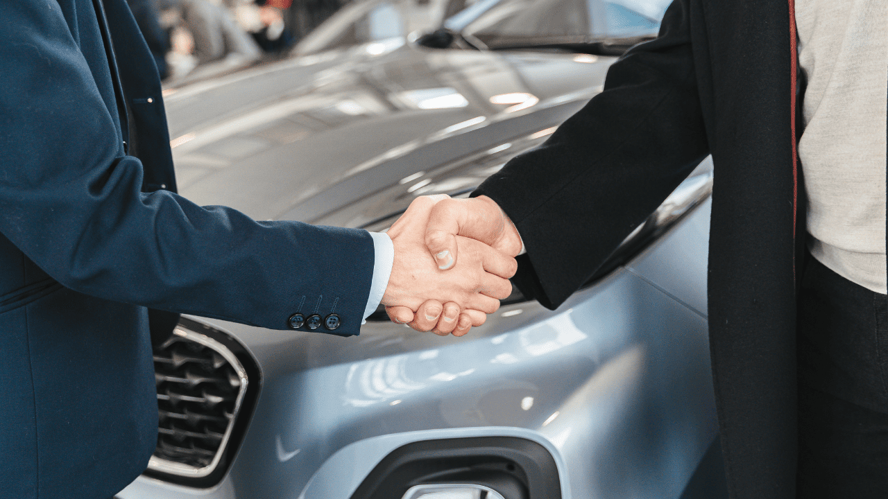 Dealer-Client Shaking Hands